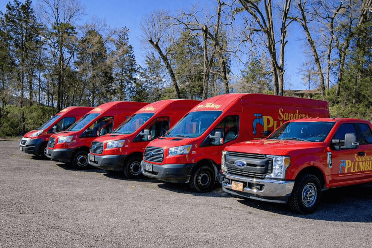 Sanders Plumbing Team in Front of Service Trucks in Knoxville